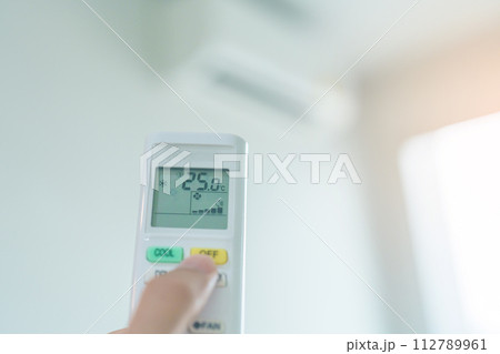 hand operating remote controller for adjust Air conditioner inside the room of office or house hand operating remote controller for adjust Air conditioner inside the room of office or house 112789961