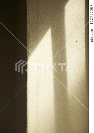 Comfortable rest by the sunny window. A background with sunlight and shadows that can be used in various designs. 112791367