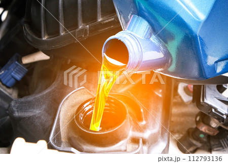 Refueling and pouring oil quality into the engine motor car Transmission and Maintenance Gear .Energy fuel concep Refueling and pouring oil quality into the engine motor car Transmission and Maintenance Gear .Energy fuel concep 112793136
