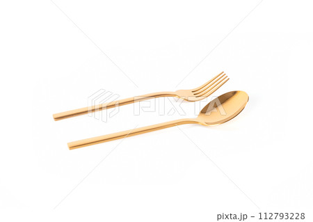 luxury golden stainless steel spoon and fork on white background luxury golden stainless steel spoon and fork on white background 112793228
