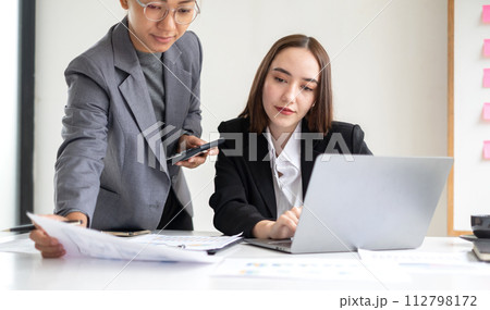 Business leaders talk about charts and finance graphs showing results are analyzing and calculating planning strategies, business success-building processes 112798172