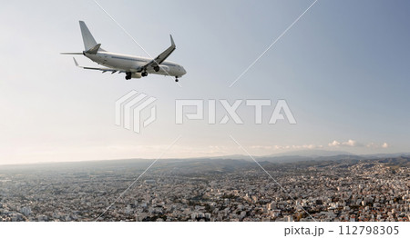 Passengers commercial airplane flying above Limassol city, Cyprus Passengers commercial airplane flying above Limassol city, Cyprus 112798305