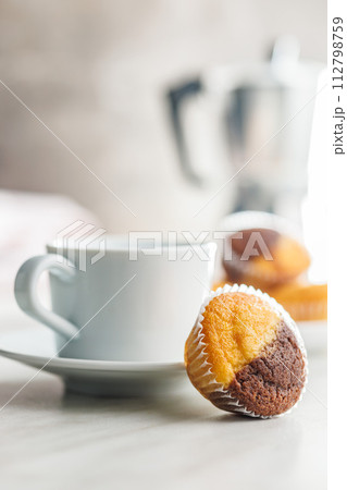 Close Up of a Muffin on a white Table 112798759
