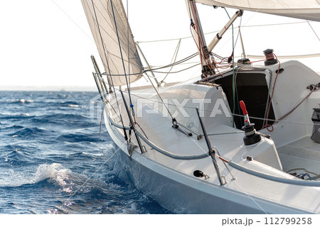Close-up of sailing yacht in a rough sea 112799258