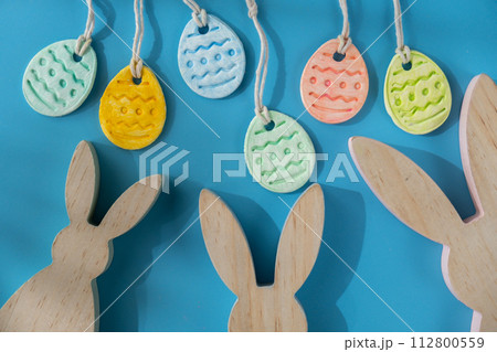 Do it yourself air dry clay crafts for Easter holiday. Decoration gift idea Handmade children craft. Step by step instruction of painting, pressing figures Do it yourself air dry clay crafts for Easter holiday. Decoration gift idea Handmade children craft. Step by step instruction of painting, pressing figures 112800559