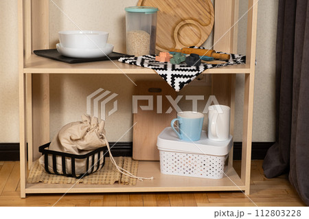 Modern kitchen wooden shelf and kitchenware 112803228