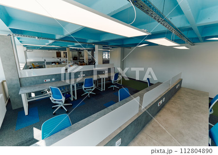 Photo of a modern office where programming, digital marketing and web design projects are done. Office with modern furniture and glass office 112804890