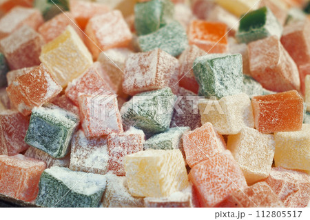turkish delight or lokum of red, green, orange and yellow colors. turkish delight or lokum of red, green, orange and yellow colors. 112805517