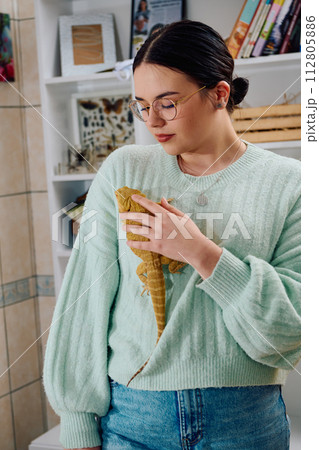 Beautiful Woman Posing with Her Adorable Bearded Dragon Pets Beautiful Woman Posing with Her Adorable Bearded Dragon Pets 112805886