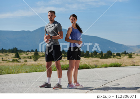 After-Run Relaxation: Romantic Couple Rests Following Intense Training Session. 112806071