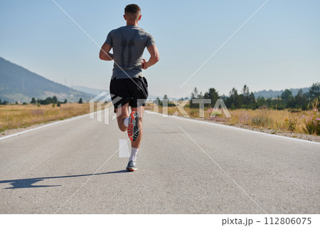A dedicated marathon runner pushes himself to the limit in training. A dedicated marathon runner pushes himself to the limit in training. 112806075