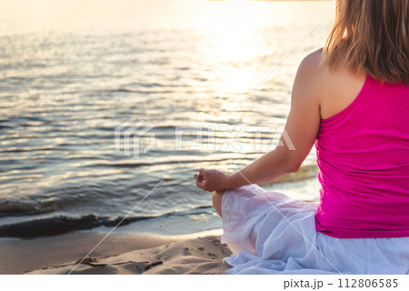 Woman meditating at the sea Woman meditating at the sea 112806585
