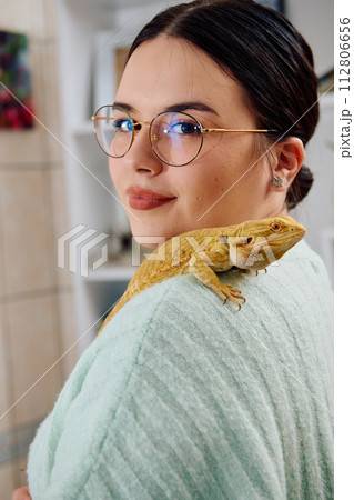 Beautiful Woman Posing with Her Adorable Bearded Dragon Pets Beautiful Woman Posing with Her Adorable Bearded Dragon Pets 112806656