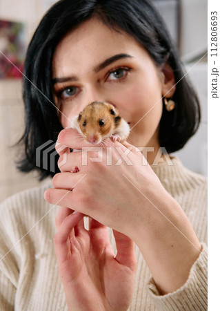 A Black-Haired Beauty Enjoys a Cozy Day at Home with Her Pet Mouse A Black-Haired Beauty Enjoys a Cozy Day at Home with Her Pet Mouse 112806693