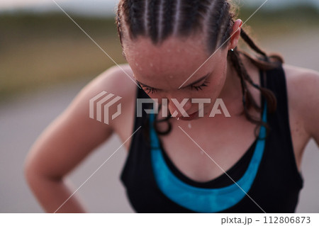 Close-Up Portrait of Determined Athlete Resting After Intense Workout 112806873