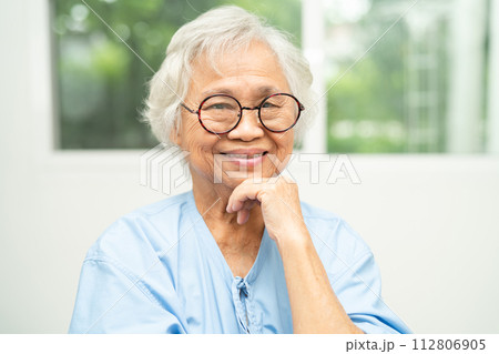 Asian senior woman wearing eyeglasses or vision glasses at home care service. Asian senior woman wearing eyeglasses or vision glasses at home care service. 112806905