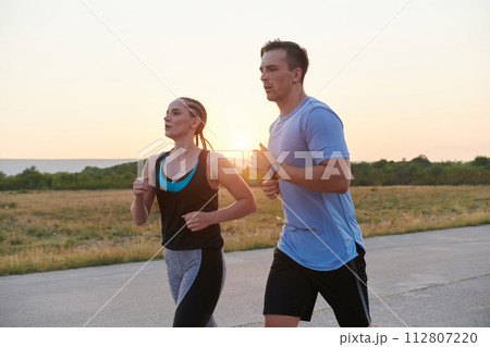 Dynamic Duo: Fitness-Ready Couple Embraces Confidence and Preparation for Upcoming Marathons Dynamic Duo: Fitness-Ready Couple Embraces Confidence and Preparation for Upcoming Marathons 112807220
