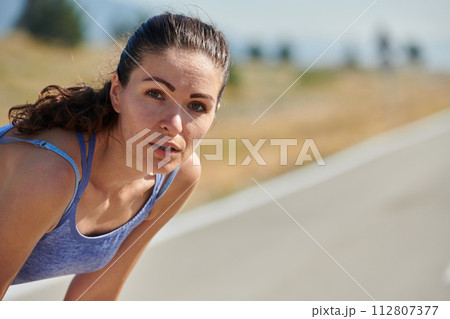 Close-Up Portrait of Determined Athlete Resting After Intense Workout 112807377