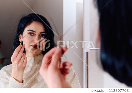 Young Woman Captured in a Beautiful Moment with Her Stick Insect (Medauroidea Extradentata) 112807708
