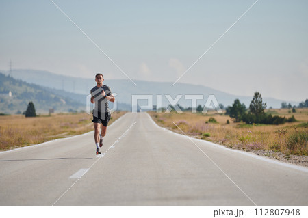 A dedicated marathon runner pushes himself to the limit in training. A dedicated marathon runner pushes himself to the limit in training. 112807948