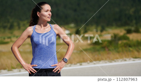 Close-Up Portrait of Determined Athlete Resting After Intense Workout 112807963