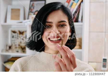 Young Woman Captured in a Beautiful Moment with Her Stick Insect (Medauroidea Extradentata) 112808447