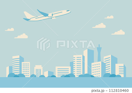 都会のビル群と旅客機のシンプルな風景 112810460