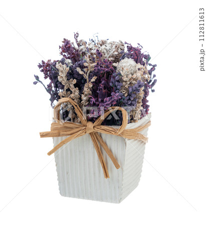 Artificial flowers in a vase of lavender and lavender flowers isolated on a white background. 112811613