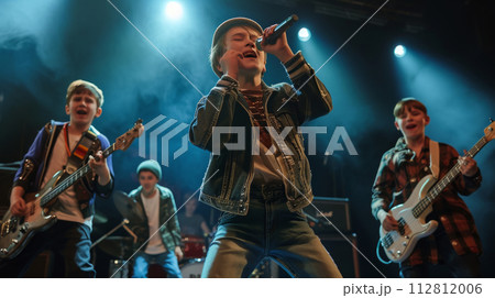 Young Boy Band Performing on Stage 112812006
