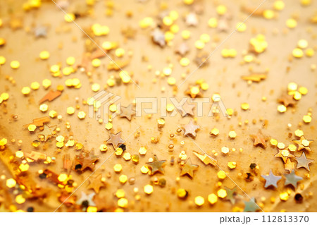 Cosmetic gel with glitter on a beige background. Cosmetic gel with glitter on a beige background. 112813370