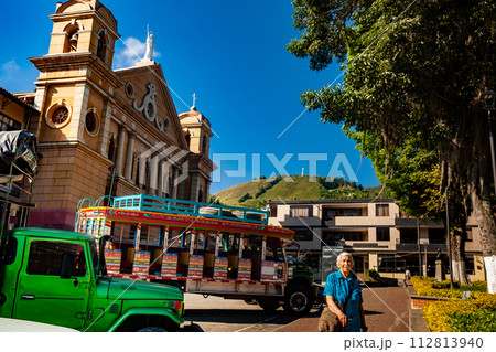Senior woman tourist at the central square of the beautiful small town of Pacora in the department of Caldas in Colombia 112813940
