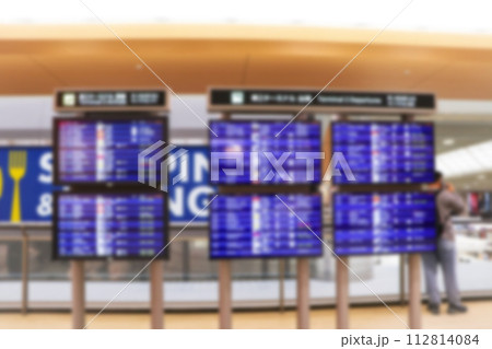 Blurred image of Boarding time monitor screens timetable boards for departures monitors to check status of flight on airport. Abstract background textures. 112814084