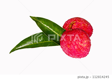 Juicy Lychee with green leaves isolated on white background. Clipping path. Has red shell. Fruit that has delicious, sweet aroma. Peel has antioxidant properties. Can be processed into canned fruit.	 112814245