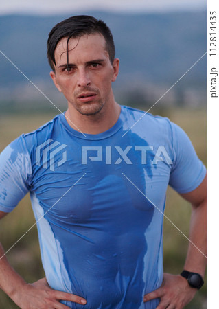 Post-Run Repose: Sweaty Athlete Rests After Intense Daily Run. Post-Run Repose: Sweaty Athlete Rests After Intense Daily Run. 112814435