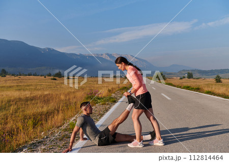 Morning Stretch: Romantic Couple Prepares for Early Morning Run Morning Stretch: Romantic Couple Prepares for Early Morning Run 112814464