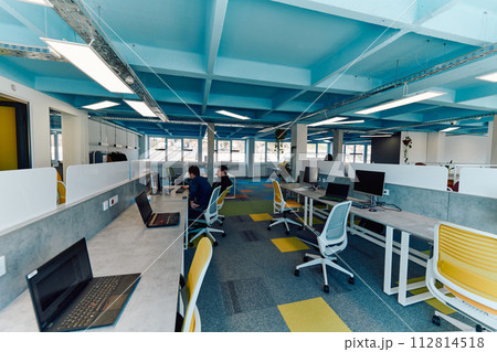 Photo of a modern office where programming, digital marketing and web design projects are done. Office with modern furniture and glass office Photo of a modern office where programming, digital marketing and web design projects are done. Office with modern furniture and glass office 112814518