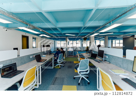 Photo of a modern office where programming, digital marketing and web design projects are done. Office with modern furniture and glass office 112814872