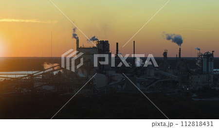 Aerial view of large factory with smokestack from production pro 112818431