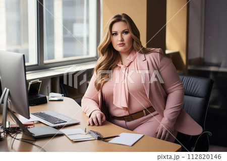 Office worker, beautiful woman at workplace. Plus-size manager 112820146