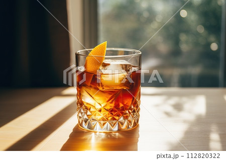 Old fashion cocktail on a wooden table. Beautiful background with bokeh. 112820322