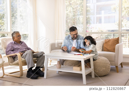 Happy Indian grandpa and granddaughter girl drawing in paper album 112820867