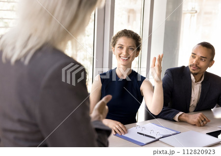 Seminar participant raise hand to ask question 112820923