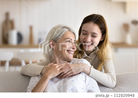 Loving teenager daughter hugging mature attractive mother 112820948