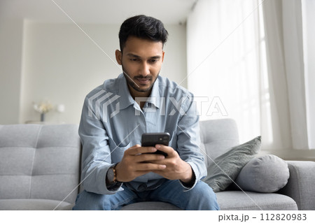 Man read sms, lead on-line chat using smartphone 112820983