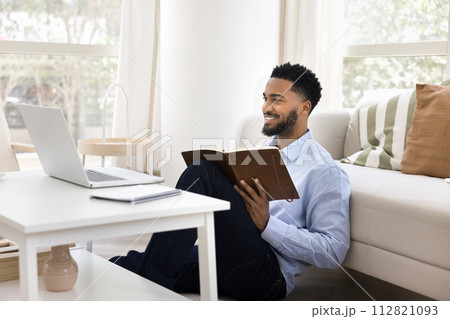 Positive African American student man using laptop for online education Positive African American student man using laptop for online education 112821093