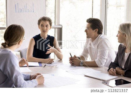 Young and ambitious businesspeople take part in group meeting Young and ambitious businesspeople take part in group meeting 112821337