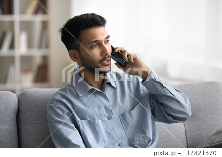 Indian man talking to customer services by phone call 112821370