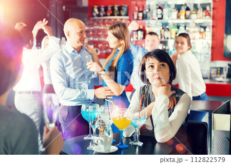 Woman tired during corporate party 112822579