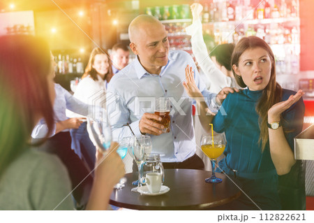 Man trying to talk with angry woman Man trying to talk with angry woman 112822621