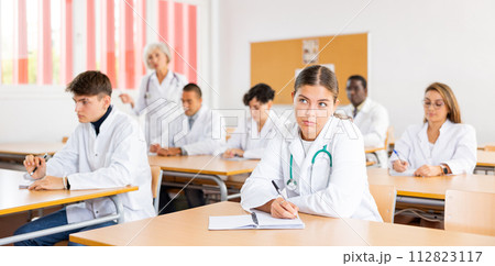 Group of medical students in classroom Group of medical students in classroom 112823117